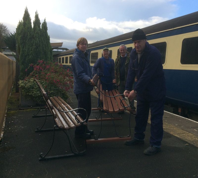 The DRSA team from left John Caesar, Tom Baxter, Tony Hill and Jon Kelsey unloading one of the new benches. Photo copyright Robin White of the West Somerset Railway Asssociation.