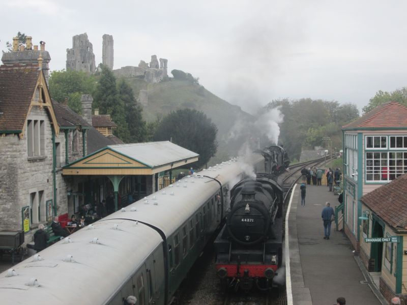 Corfe Castle. U class 2-6-0 no. 31806 and Battle of Britain class 4-6-2 no. 34053 Sir Keith Park double-heading, LMS Black 5 4-6-0 no. 44871 about to join the rear of the train. They probably had adequate power.brPhotographer Andrew TurnerbrDate taken 12102018