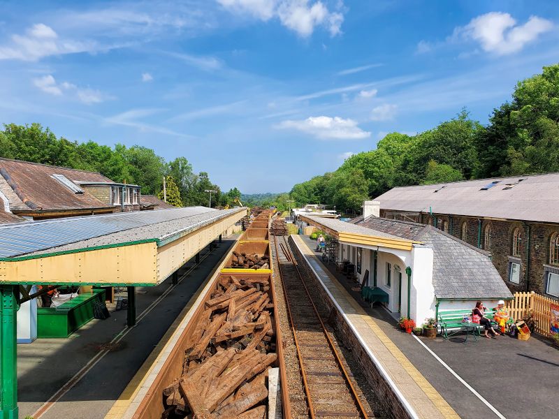 View from the Okehampton Station footbridge of the train partially loaded with old sleepersbrPhotographer Alan PetersbrDate taken 23062021