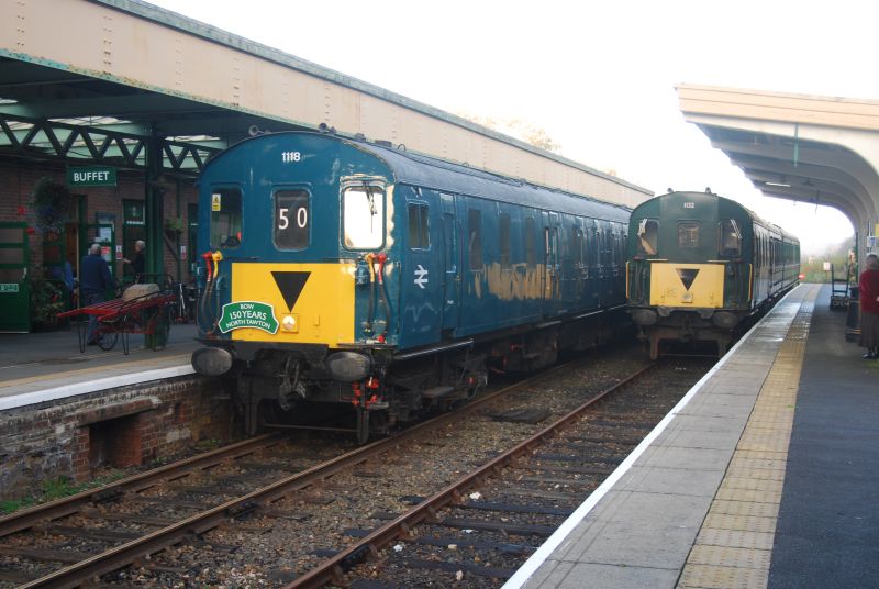 Class 205 Thumper 1118 on arrival at Okehampton at the end of the Bow & North Tawton sesquicentennial festivities. 1132, currently out of service, is alongside in Platform 2. 