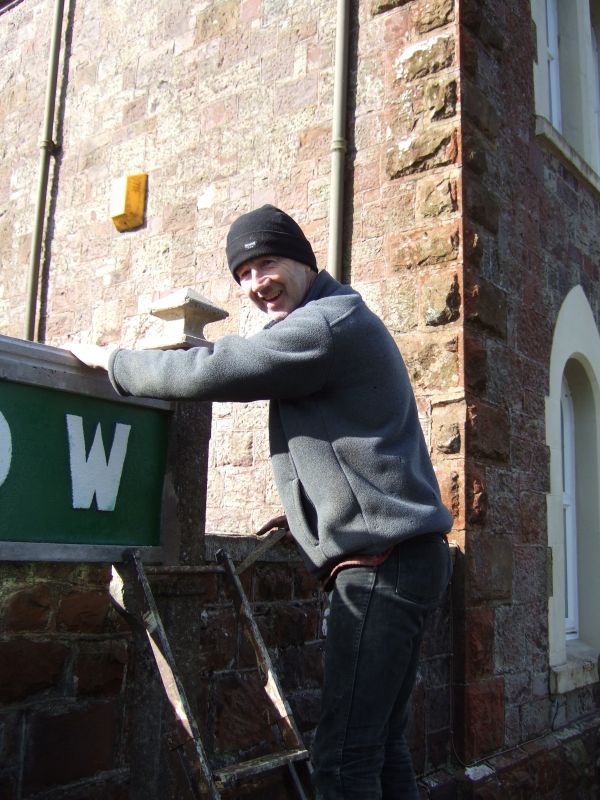 Simon at work on the new sign.