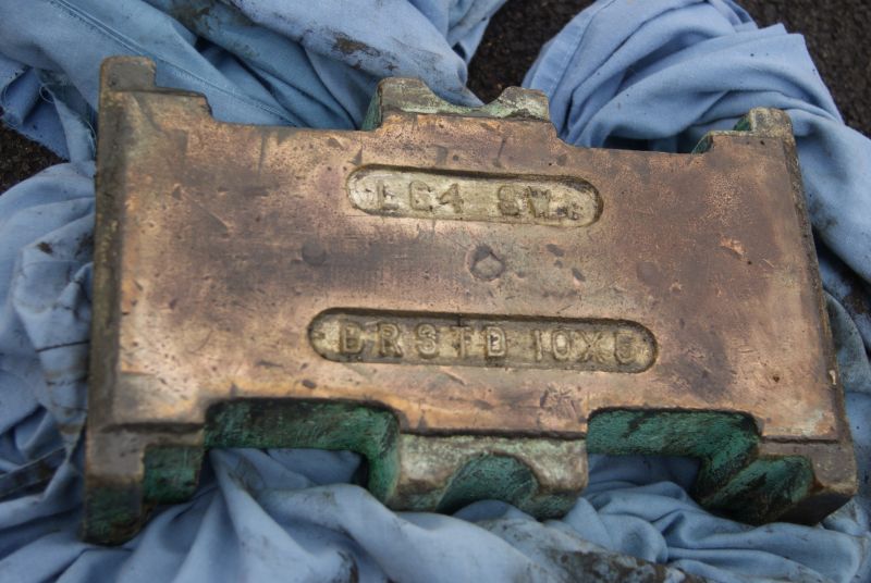 After a number of false starts we figured out how to get the bearing out of the one good axlebox. It's marked 'BRSTD 10x5' and 'LG4 SW1'. We understand this means the journal is 10 long and 5 diameter. LG4 is a grade of bronze. SW1 describes the white metal.brPhotographer Jon KelseybrDate taken 11062016