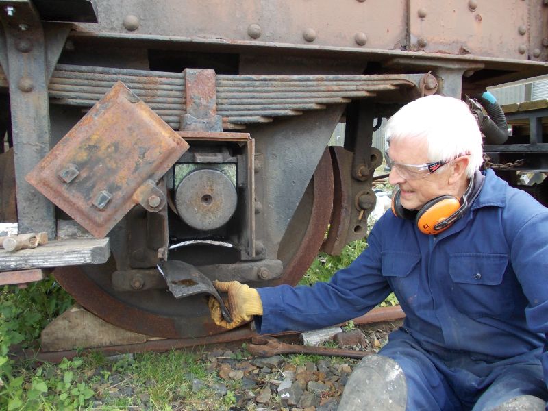 John Coxon after grinding off the distorted bottom plate of an axlebox.brPhotographer Jon KelseybrDate taken 23072016