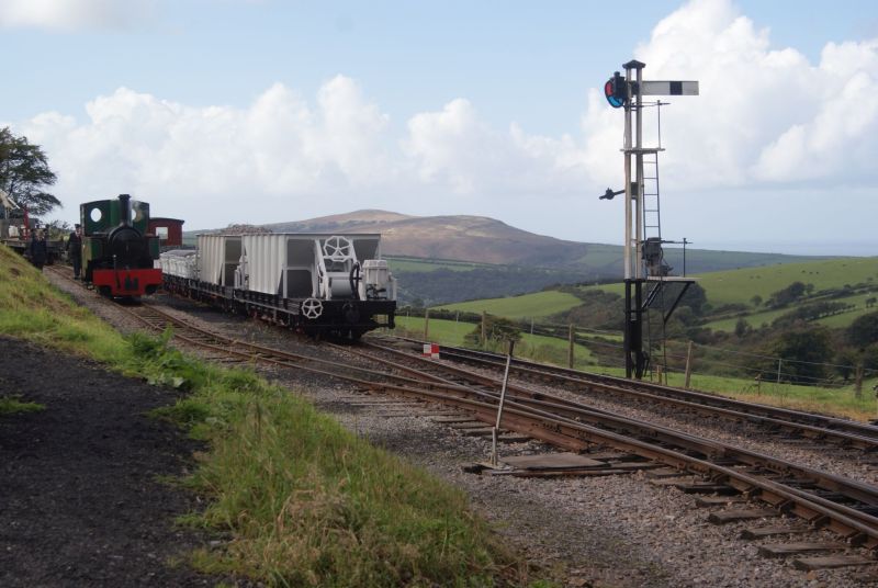 Kerr, Stuart 0-6-0T 'Axe', hopper wagons and fine Exmoor scenery beyond.brPhotographer Jon KelseybrDate taken 25092016