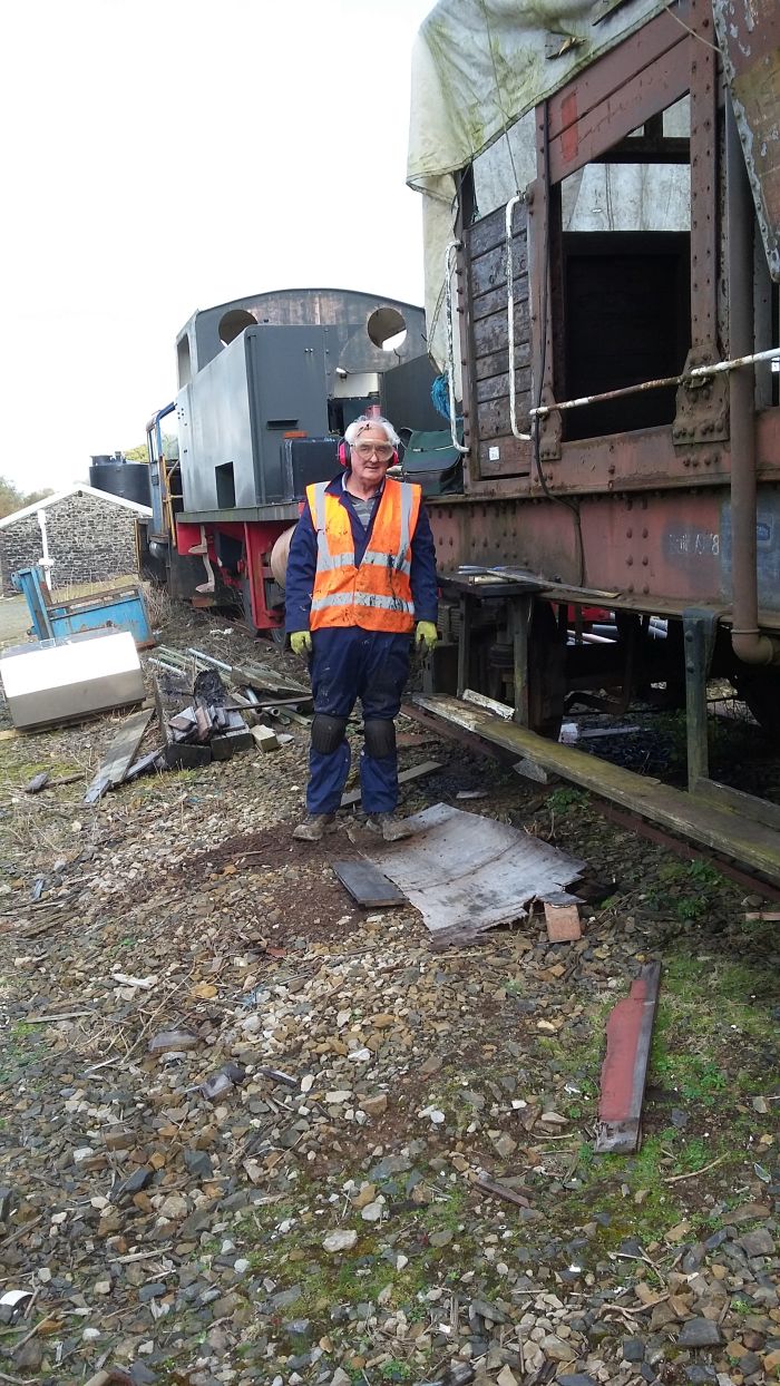 Patrick Doyle standing on a pile of rust and rotten wood he has just removed from LDS55625brPhotographer David BellbrDate taken 12102017