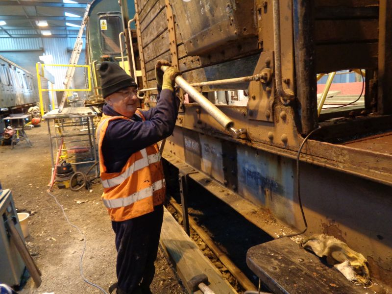 Patrick Doyle removing 70 year old floor retaining bolts with great effort and eventual success.brPhotographer David BellbrDate taken 11012018