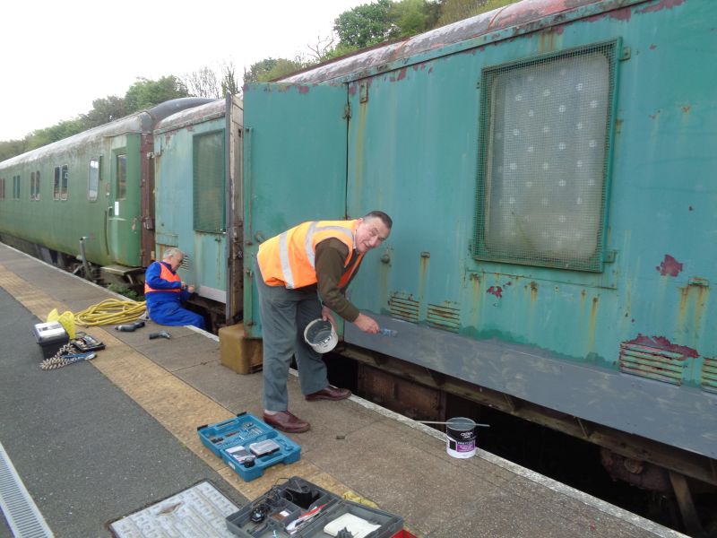 Patching rusty panels on CCT van 94691. Plating cut and formed by John Coxon, drilled and fixed by Paul Vodden and then primed by David Bell. It's time we invested in a bigger brush.brPhotographer John CoxonbrDate taken 12052018