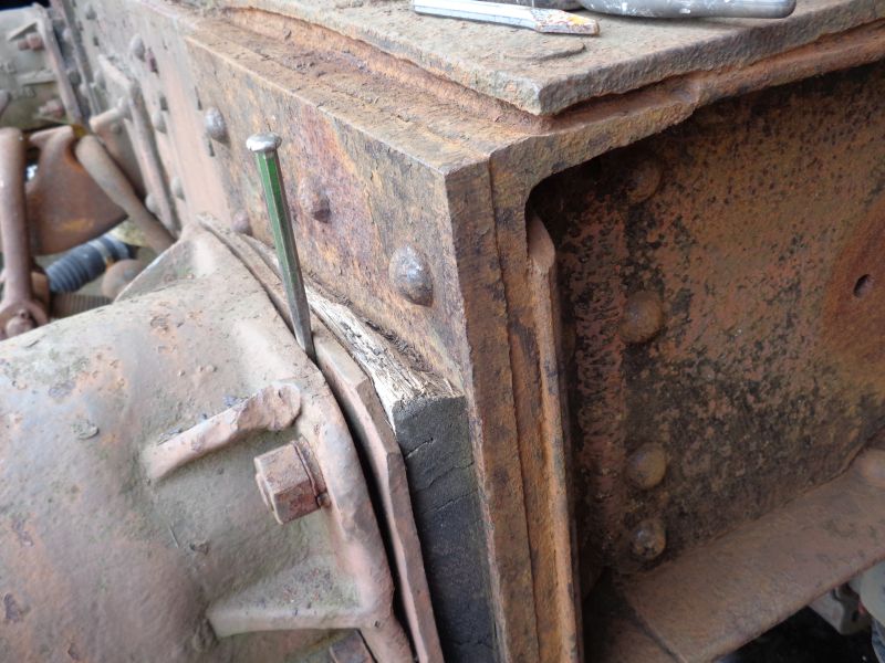 The brake-van headstock during rust and paint removal. The rotten oak plate can be seen and the cold-chisel wedged in the resultant gap. From examination of the heavy steel plates in the area it would seem that the brake van has suffered from a heavy shunt at sometime during its previous BR existence. One hopes that the guard wasn't aboard at the time Just a muse by your correspondent whilst chipping away at the rustbrPhotographer David BellbrDate taken 02082018