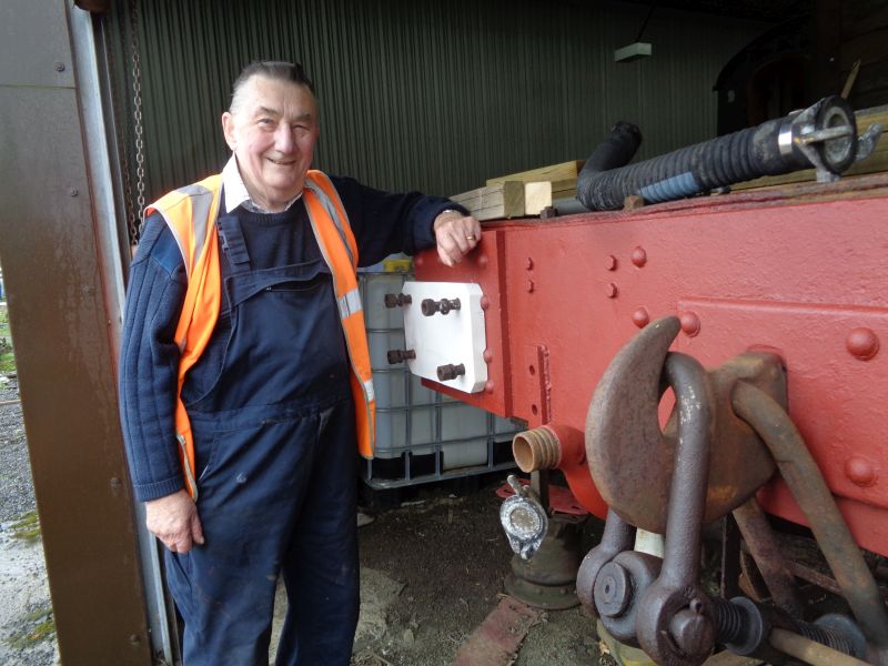 Your correspondent proudly displays one of the pair of oak plates now fitted on the brake van headstock. Protective steel plates will be fitted next, to avoid damage by action of the compressed springs, before the buffers are replaced. One of these prepared plates can be seen on an upturned buffer below the headstock.brPhotographer John CoxonbrDate taken 11102018