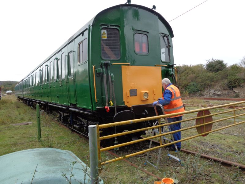 Allan Harris putting some finishing paint touches to the driving car of Thumper 1132brPhotographer David BellbrDate taken 25102018