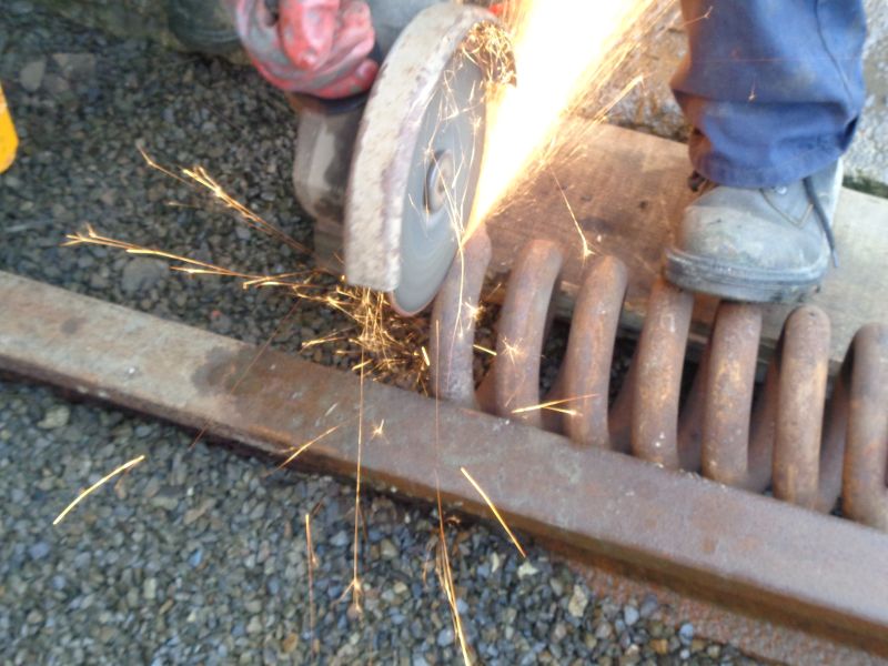 Trimming off the jagged end of the broken buffer spring so that it sits squarely against the spacer when compressedbrPhotographer David BellbrDate taken 06122018