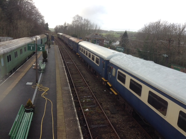 View of Okehampton station looking in the Plymouth direction, showing the train's rather motley collection of carriages, including several air-conditioned Mk 2s.brPhotographer Tony HillbrDate taken 22122018