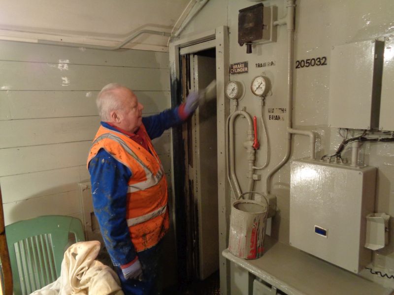 Alan Harris painting in the warm comfort provided by the floodlight. His hand moves so fast it's just a blur.brPhotographer David BellbrDate taken 03012019