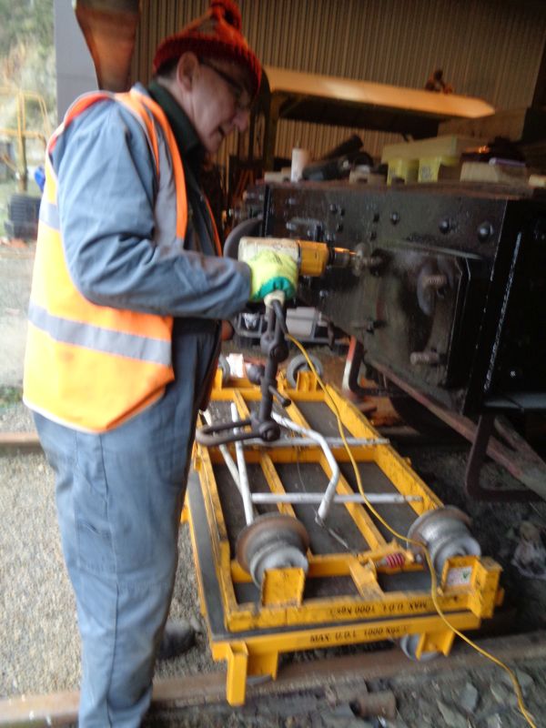 Threads on the brake van buffer retaining bolts being cleaned out then oiled.brPhotographer John CoxonbrDate taken 03012019