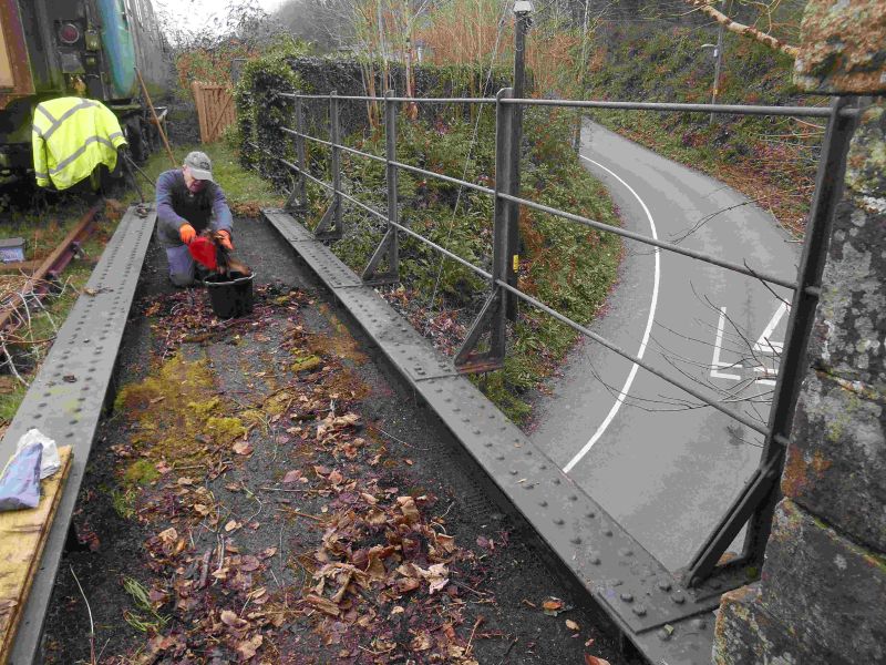 Paul Vodden preparing to fit new timber to bridge 609. It will reduce the large gap between the bridge girder and the lowest railing.brPhotographer Sue BaxterbrDate taken 05012019