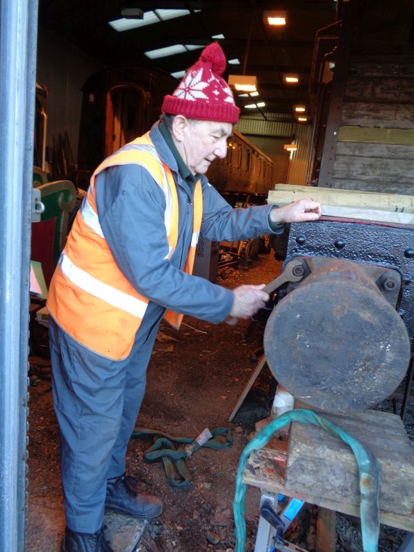 Your correspondent tightens up the bolts whilst the others prepare the other buffer for lifting.brPhotographer John CoxonbrDate taken 17012019
