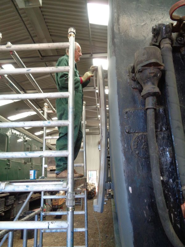 Nigel Green rubbing down the undercoat on the internal door trims on Thumper 1132.brPhotographer David BellbrDate taken 28032019