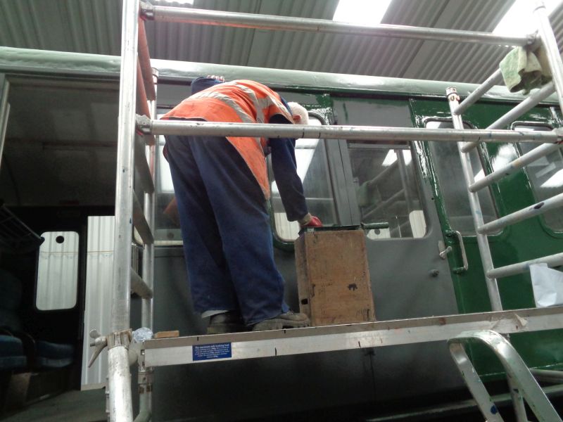 John Coxon picks out window frames whilst applying a first topcoat to the other end of the Thumper.brPhotographer David BellbrDate taken 09052019