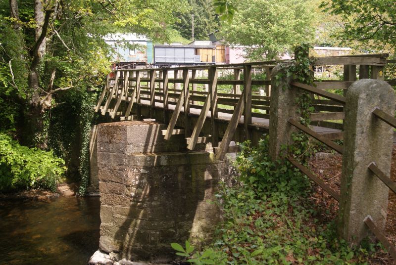 Access to the site is across this pedestrian bridge over the River Teign - there must be a story behind that skinny deck on big piers. brPhotographer Jon KelseybrDate taken 15052019