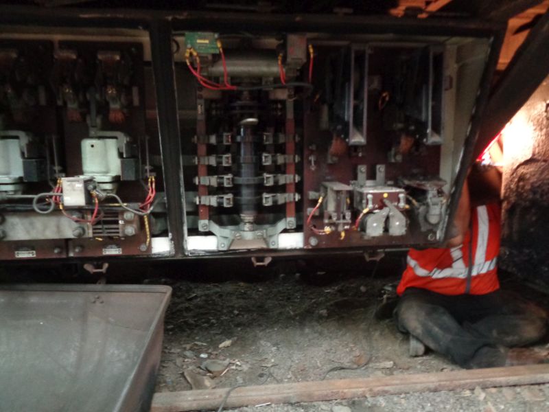 Replacement DC heavy duty switch being fitted. For the technical minded, the tall black cylindrical item in the centre of the panel is the DC current reversal switch, which in an emergency can be hand operated in order to reverse the train.brPhotographer David BellbrDate taken 23052019