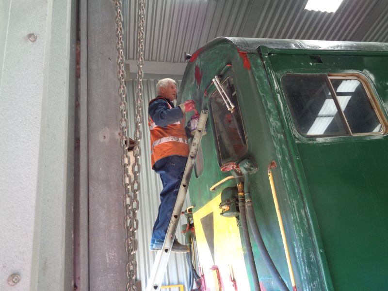 John Coxon applies primer to Thumper 1132 power car.brPhotographer David BellbrDate taken 04072019