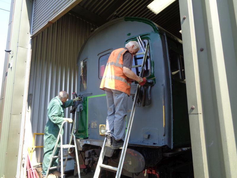 John Coxon and Nigel Green applying topcoat to the Thumper power car in a nice cool breezebrPhotographer David BellbrDate taken 25072019