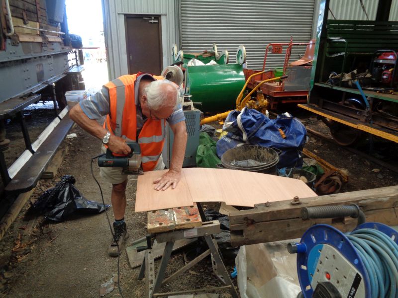 Cutting out a sheet for the internal trim of the SR brake van cabin. Partick Doyle wielding the power jig-saw.brPhotographer David BellbrDate taken 25072019