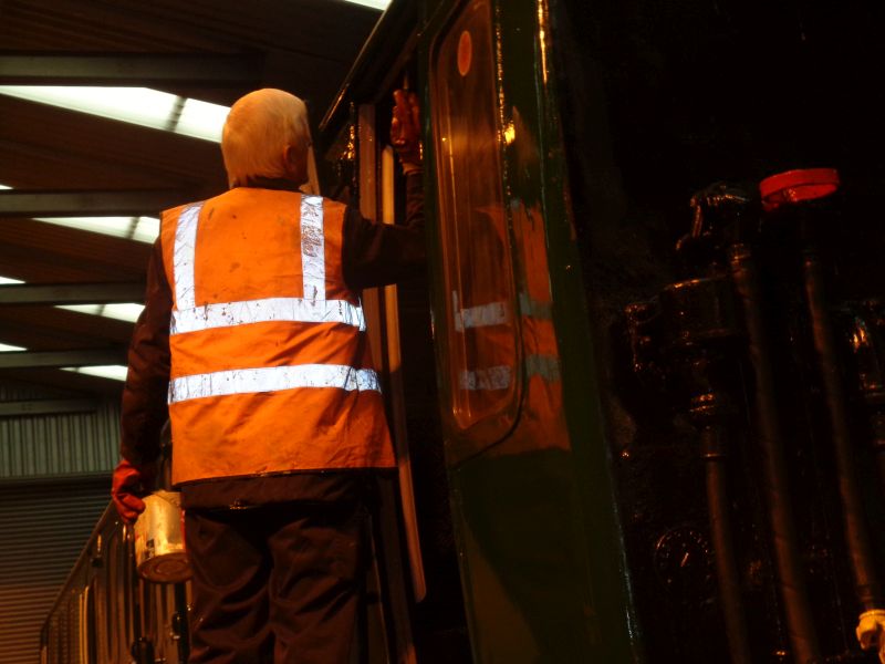 Reflected in the gleaming paintwork, John Coxon paints door trims.brPhotographer David BellbrDate taken 28112019