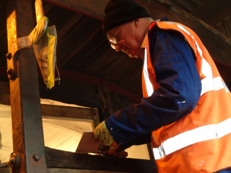Filler being applied to the veranda top rail by Patrick Doyle - to prevent the fare-paying punters getting splinters.brPhotographer David BellbrDate taken 28112019