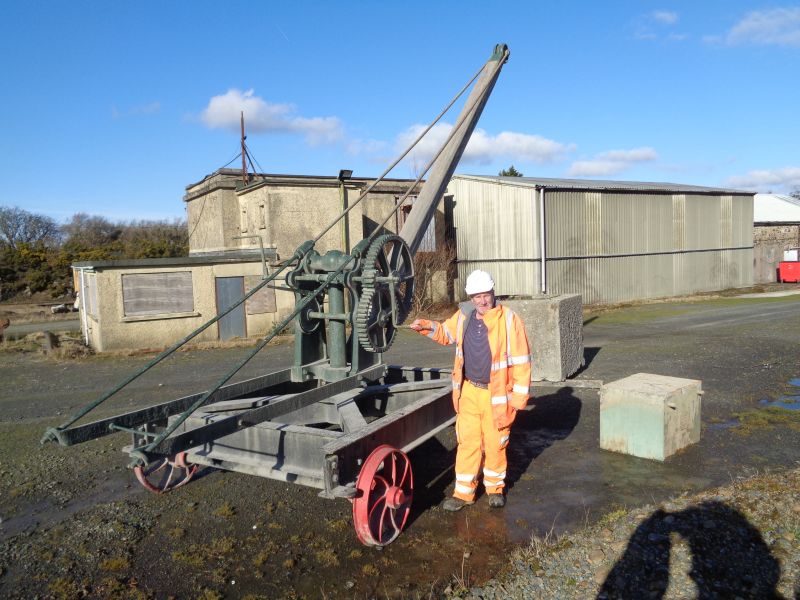 Graham Hicks with Aggregate Industries' restored crane at Meldon.brPhotographer David BellbrDate taken 06022020