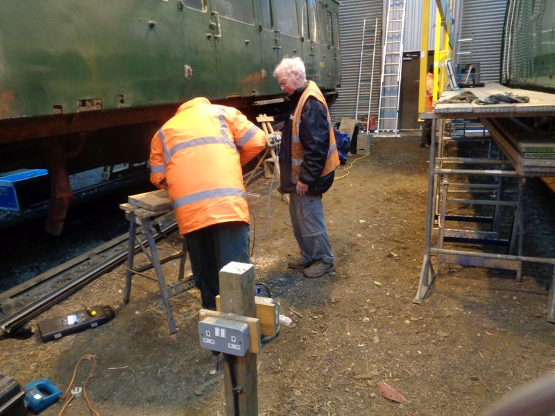 Geoff watches as the first buffer slab is cut to size.brPhotographer David BellbrDate taken 12032020