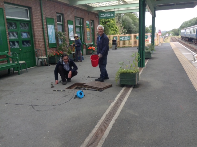 David and Tom celebrating unblocking one of Platform 3's drainsbrPhotographer Tony HillbrDate taken 22082020