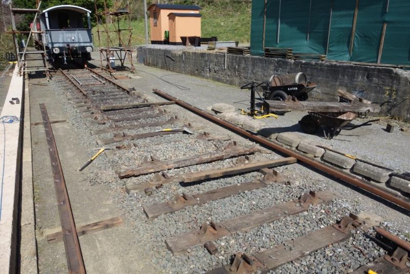 How many people do you know who do standard gauge trackwork on their own I've been meaning to change one rotten sleeper for about three years and finally got on with it at the weekend. With the G.W.-type of bolted chair, with the nut on top, it is difficult to extract a sleeper without removing the rails. Because bullhead rails are tipped out into the four-foot, it makes sense to take them to opposite sides using boards. You can see that the left hand rail has gone over the empty chairs on the right. The old sleeper had gone to pulp but is the only one I've changed in the 25 years this road has been down. 