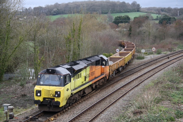 Cowley Bridge Junction Wednesday 10032021. Colas loco 70812 heading the 1255 Crediton to Westbury via Exeter Riverside Yard, with 15 empty bogie wagons, mostly Falcons, with 70810 dead on the rear, having delivered the first trainload of ballast to a site on the Okehampton line.brPhotographer Mark FishlockbrDate taken 10032021