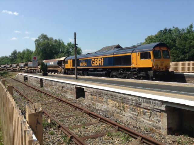 GBRf class 66 66784 'Keighley  Worth Valley Railway' arrived overnight on July 20th with a train of  autoballasters. After unloading it proceeded to Meldon to run round, then idled at Okehampton before heading back to Westbury late in the afternoon, via a second runround at Exeter Riverside. brPhotographer Tony HillbrDate taken 21072021