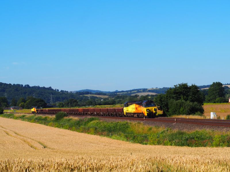 Seen on Sun 10th July 2022 near Stoke Canon is the 0815 Engineers train from Crediton to Westbury with Colas class 70 locos 70815 and 70808, having been loaded overnight SatSun 9th10th July with the last of the spoil and ballast to be cleared from the Fatherford trackworks improvements carried out over the April 25th to May 9th 2022 Okehampton line blockade.brPhotographer David TozerbrDate taken 10072022