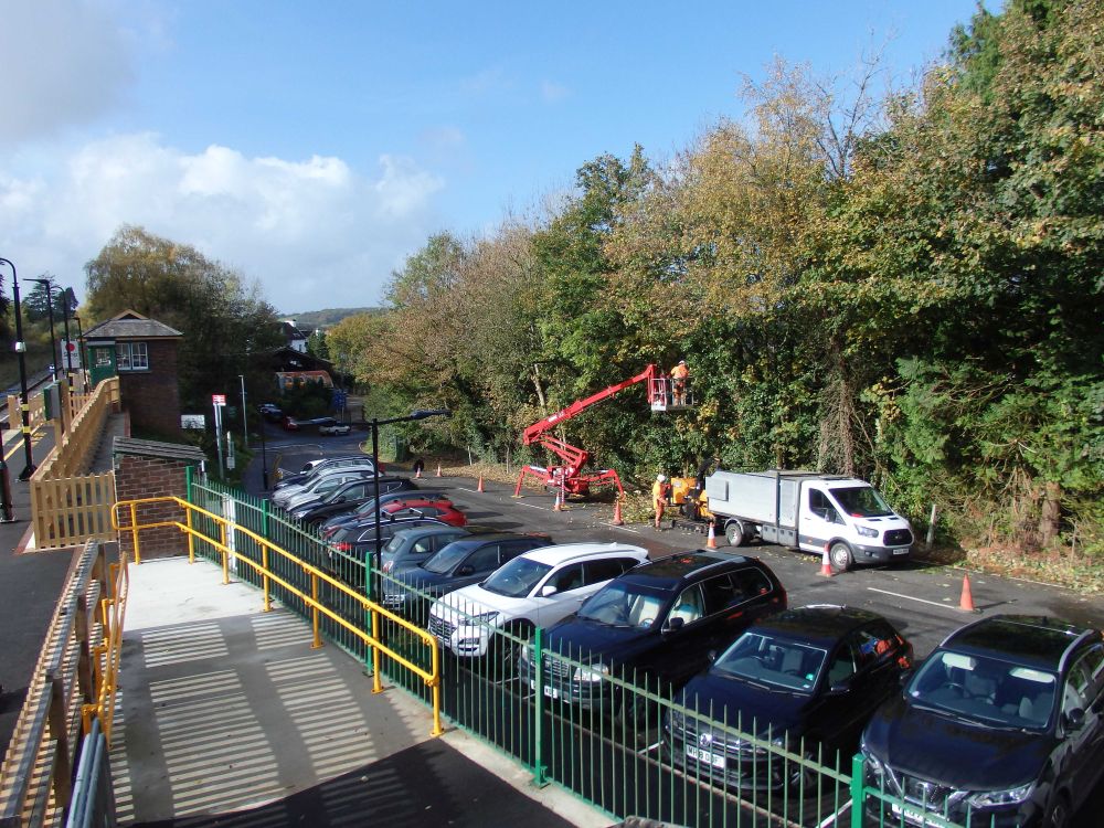 Network Rail contractors at work in Okehampton Station carpark cutting back overhanging trees to improve the clearance for double decker buses. brPhotographer Tom BaxterbrDate taken 26102022