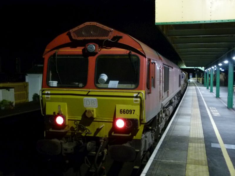 Class 66 66097 on the Exeter end of a late evening RHTT in Okehampton Station.brPhotographer Dave EllisbrDate taken 05102023