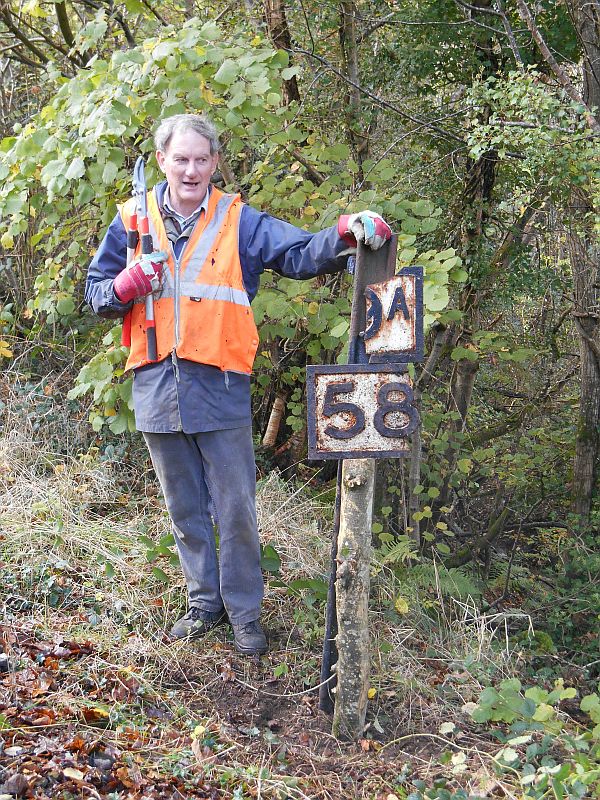 Andy Turner with some of bridge plate 589A. The rest must be somewhere in the undergrowth. The location is the culvert near Crook Farm, at the start of the westward climb to Halse Summit, between Bow and North Tawton.brPhotographer Sue BaxterbrDate taken 04112014