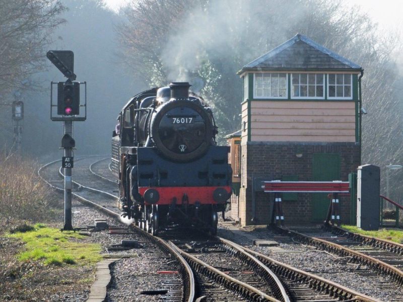 BR Standard class 4 76017 at Alton. Unusually in preservation, the signal box controls early colour light signals.