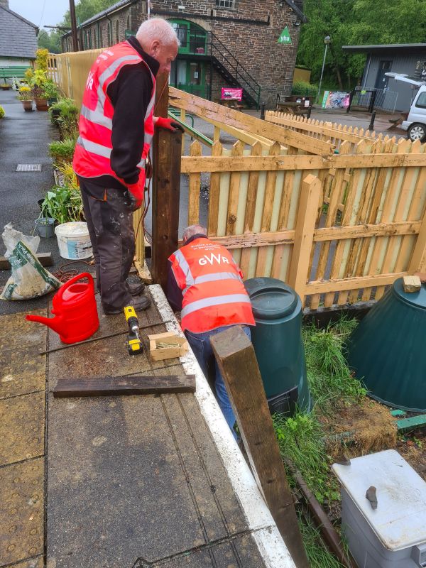 Ron hard at work on the fence repair while Dave offers moral support.brPhotographer Geoff HornerbrDate taken 20052026