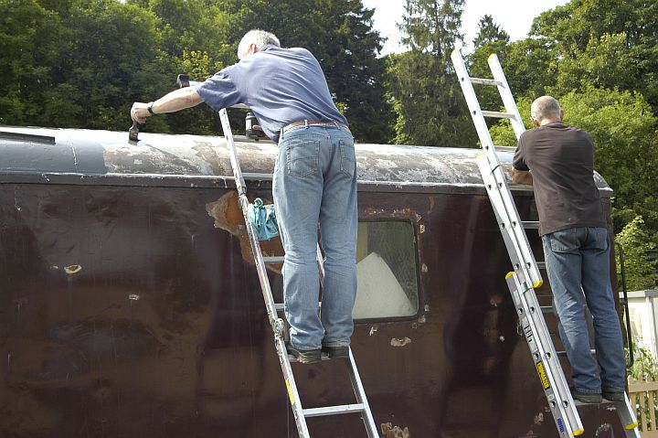 Jon and Geoff paint the Ferry Van roof. No, we didn't do the whole job with a 2 inch brush.brPhotographer Paul MartinbrDate taken 21072012