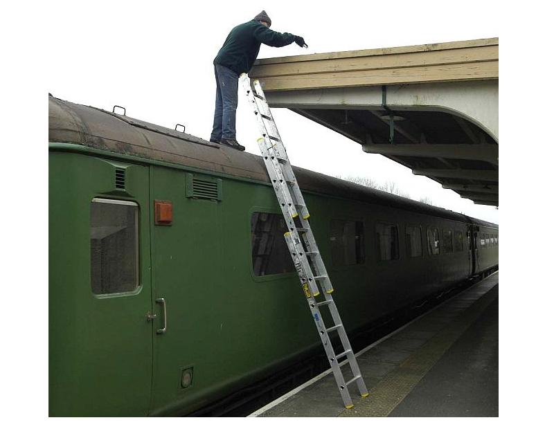 The intrepid Geoff Brooks painting the Okehampton Platform 2 canopy.brPhotographer Paul MartinbrDate taken 02032013