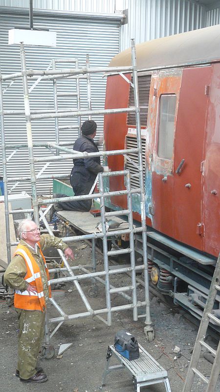 Mike Ireland working on one of the last areas of preparation whilst Phil Hull reflects on the past or contemplates the future.