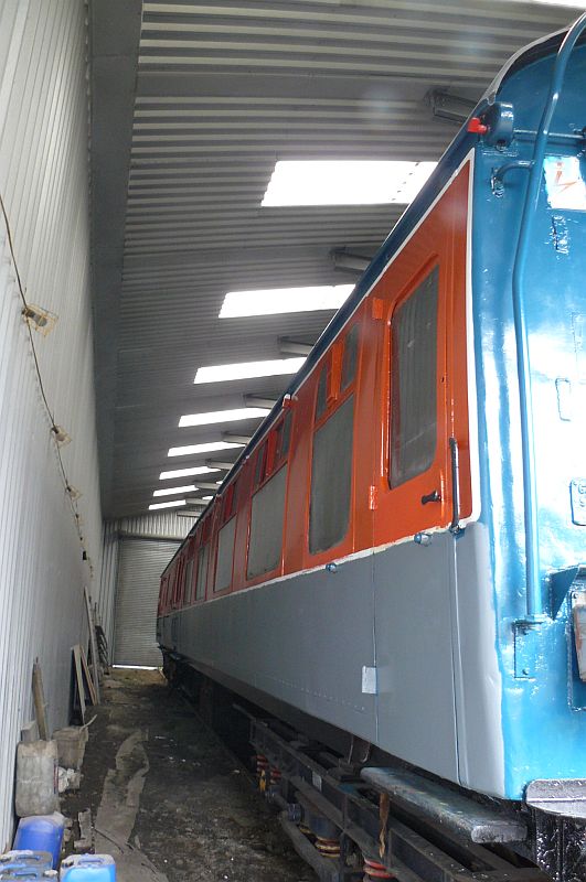 One side has been prepared and primered following the graffiti attack, and is ready for its top coats of rail blue.