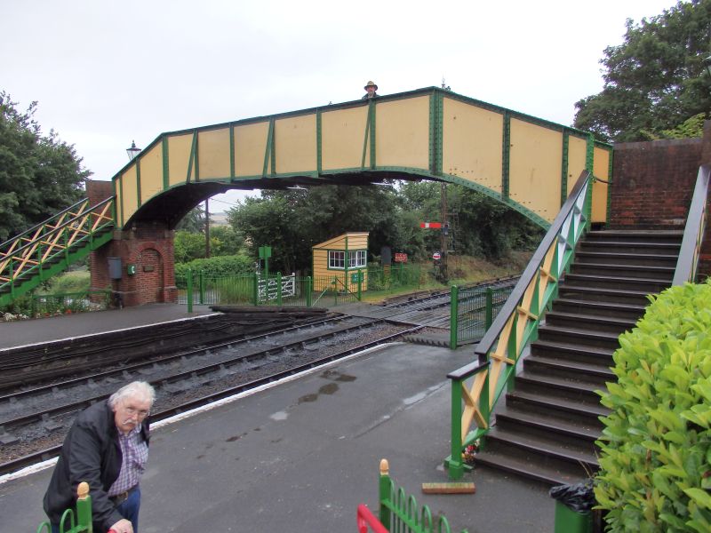 Ropley's ex North Tawton footbridge. The gentleman in the picture, one of the Baxters's WHR colleagues, was a little the worse for the previous evening's excesses, and was waiting to be banked up the bridge.brPhotographer Tom BaxterbrDate taken 24072015