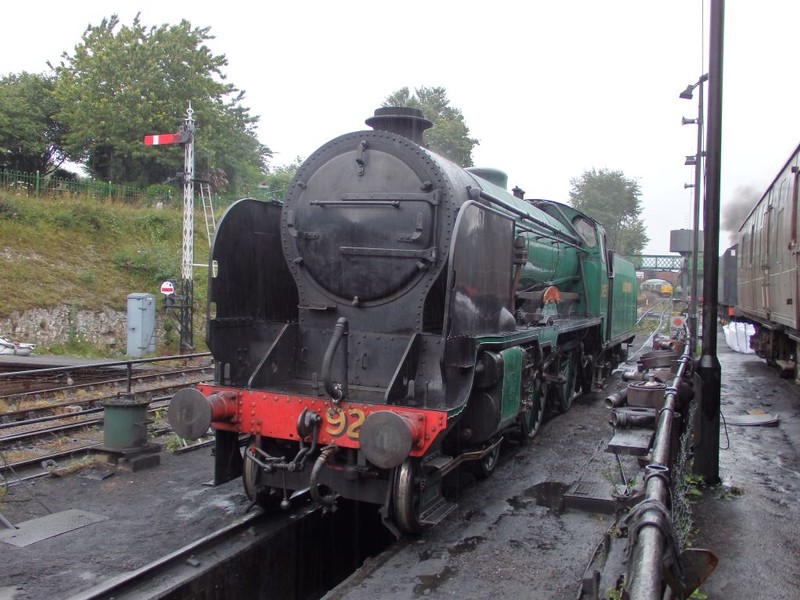 SR 'Schools' Class 4-4-0 no. 925 'Cheltenham' at Ropley. Although a 4-4-0 this design was apparently inspired by the much larger 'Lord Nelson' 4-6-0 and incorporated some of its features. The Schools class being smaller and designed to cope with lines with a restricted loading gauge, such as the Tonbridge to Hastings route. In the distance can be seen some of the MHR diesel fleet. Amongst them a number of class 37s. The footbridge in the distance incidentally came from Kings Cross station in London. Neat brPhotographer Tom BaxterbrDate taken 24072015