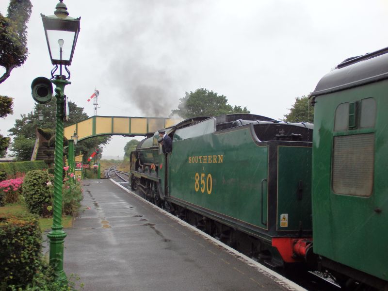 SR Lord Nelson Class 4-6-0 no. 850 'Lord Nelson' awaits departure from Ropley under the ex North Tawton footbridgebrPhotographer Tom BaxterbrDate taken 24072015