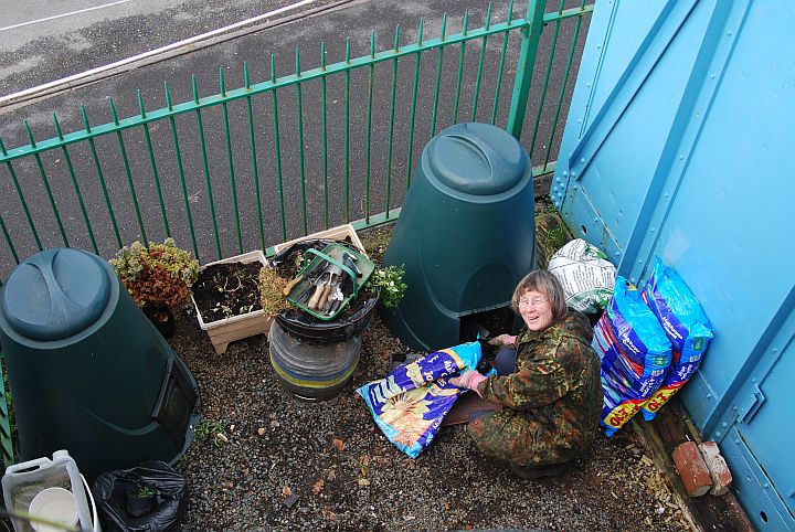 Sue Baxter preparing compost for the planters and hanging baskets on Okehampton station.brPhotographer Tom BaxterbrDate taken 09032013