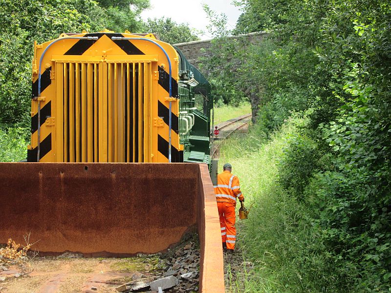 The lineside group's train with Mill Hill overbridge in the background, just before the Network Rail boundary. Quite a lot of vegetation to get stuck into.brPhotographer Andrew TurnerbrDate taken 01072014